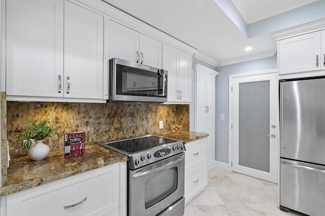 1948 Coco Palm Pl, Lauderdale By The Sea, FL 33062 - kitchen featuring appliances with stainless steel finishes, ornamental molding, dark stone countertops, white cabinetry, and decorative backsplash