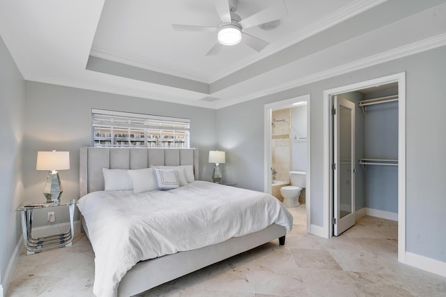 1948 Coco Palm Pl, Lauderdale By The Sea, FL 33062 - bedroom with ornamental molding, a raised ceiling, connected bathroom, a walk in closet, and baseboards