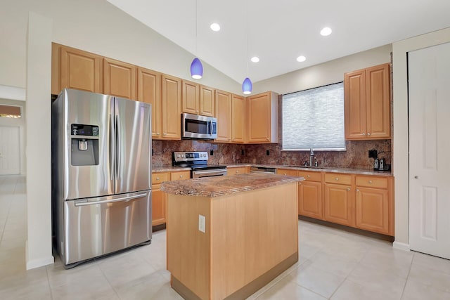 9066 Bay Harbour Cir, West Palm Beach, FL 33411 - kitchen featuring stainless steel appliances, decorative backsplash, a center island, vaulted ceiling, and light stone countertops