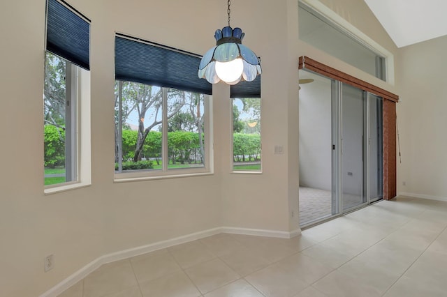 9066 Bay Harbour Cir, West Palm Beach, FL 33411 - unfurnished dining area with baseboards and tile patterned floors