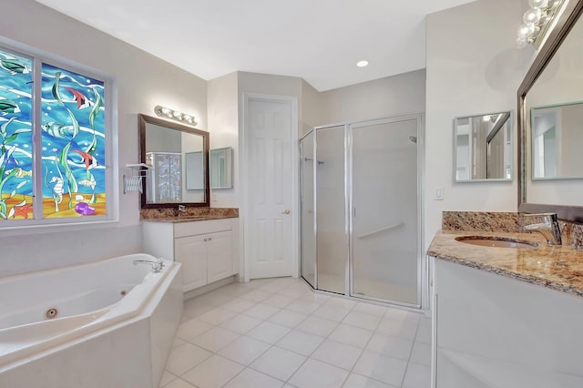 9066 Bay Harbour Cir, West Palm Beach, FL 33411 - bathroom with a shower stall, two vanities, a whirlpool tub, and tile patterned flooring