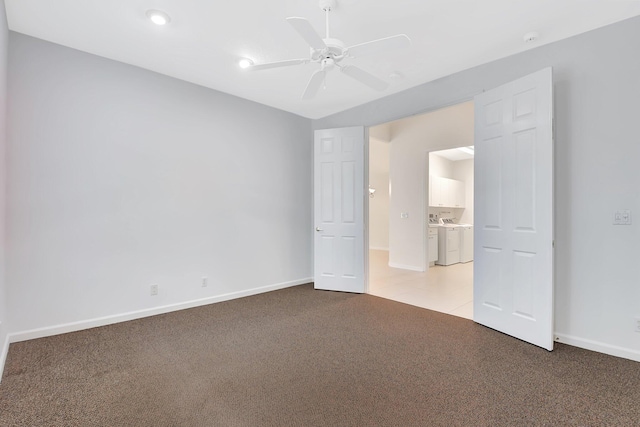9066 Bay Harbour Cir, West Palm Beach, FL 33411 - spare room with separate washer and dryer, light colored carpet, ceiling fan, baseboards, and recessed lighting