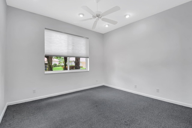 9066 Bay Harbour Cir, West Palm Beach, FL 33411 - unfurnished room featuring baseboards, ceiling fan, and dark carpet