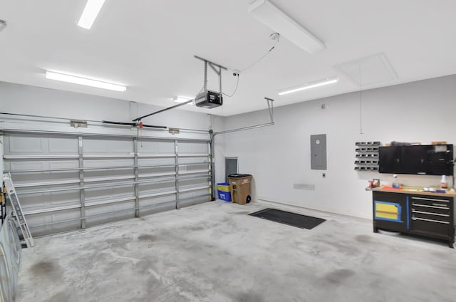 9066 Bay Harbour Cir, West Palm Beach, FL 33411 - garage featuring a garage door opener and electric panel