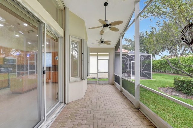 9066 Bay Harbour Cir, West Palm Beach, FL 33411 - unfurnished sunroom featuring a ceiling fan