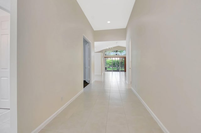 9066 Bay Harbour Cir, West Palm Beach, FL 33411 - hall with lofted ceiling, light tile patterned floors, baseboards, and recessed lighting