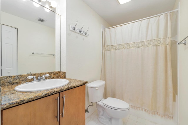 1801 N Flagler Dr Unit 107, West Palm Beach, FL 33407 - bathroom with vanity, toilet, tile patterned floors, and shower / tub combo with curtain