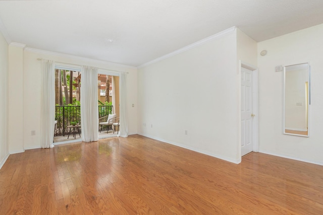 1801 N Flagler Dr Unit 107, West Palm Beach, FL 33407 - spare room featuring light wood-type flooring, crown molding, and baseboards
