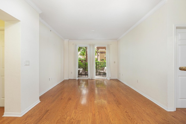 1801 N Flagler Dr Unit 107, West Palm Beach, FL 33407 - empty room with baseboards, light wood-style floors, and crown molding