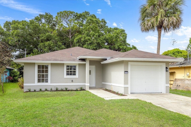 6681 4th St, Jupiter, FL 33458 - ranch-style home featuring stucco siding, an attached garage, concrete driveway, and a front lawn
