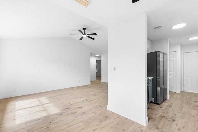 6681 4th St, Jupiter, FL 33458 - unfurnished living room featuring ceiling fan, light wood-type flooring, and baseboards