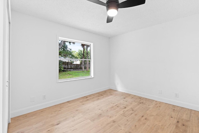6681 4th St, Jupiter, FL 33458 - unfurnished room with light wood-style flooring, ceiling fan, baseboards, and a textured ceiling