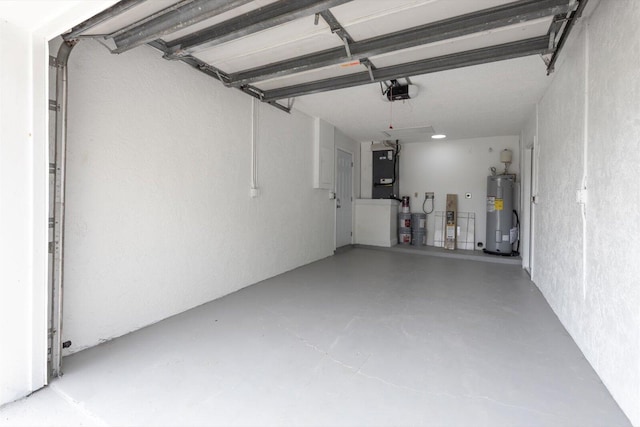 6681 4th St, Jupiter, FL 33458 - garage featuring electric water heater, a garage door opener, and a textured wall