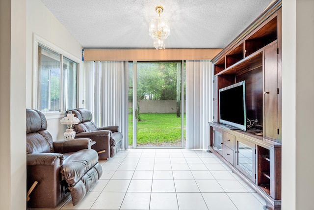 9165 Vineland Ct Unit B, Boca Raton, FL 33496 - living room featuring a textured ceiling, a chandelier, and light tile patterned floors