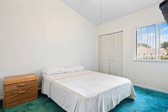 9165 Vineland Ct Unit B, Boca Raton, FL 33496 - bedroom with dark colored carpet, a closet, and vaulted ceiling