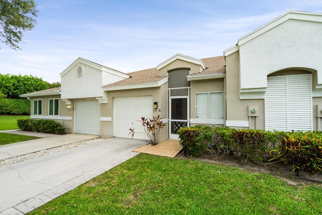 9165 Vineland Ct Unit B, Boca Raton, FL 33496 - multi unit property with an attached garage, stucco siding, a shingled roof, and a front yard