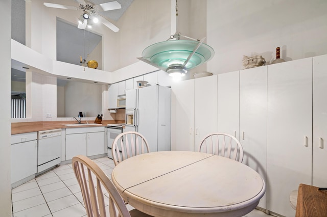 9165 Vineland Ct Unit B, Boca Raton, FL 33496 - dining space with high vaulted ceiling, light tile patterned floors, and ceiling fan