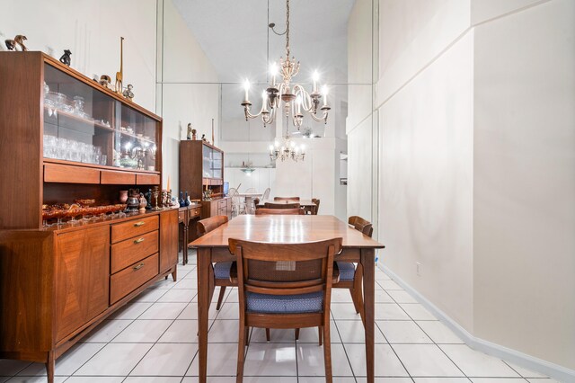 9165 Vineland Ct Unit B, Boca Raton, FL 33496 - dining room featuring a chandelier, light tile patterned floors, and a towering ceiling