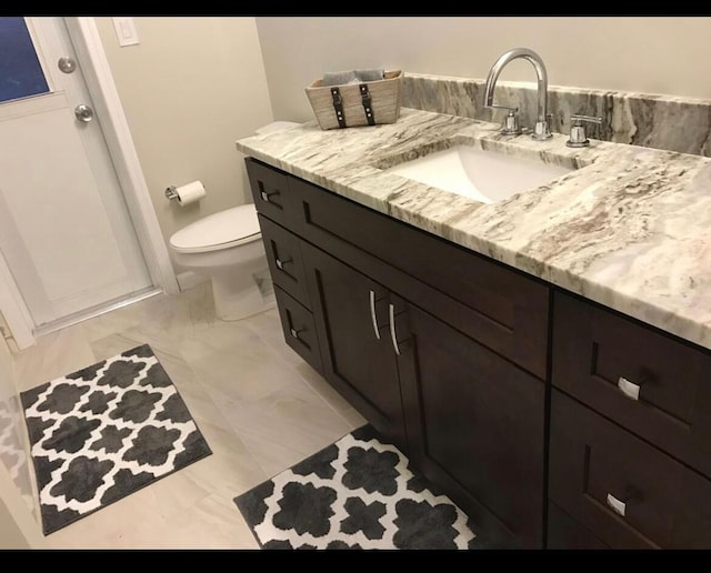 3313 Sherwood Blvd, Delray Beach, FL 33445 - bathroom with vanity, marble finish flooring, and toilet