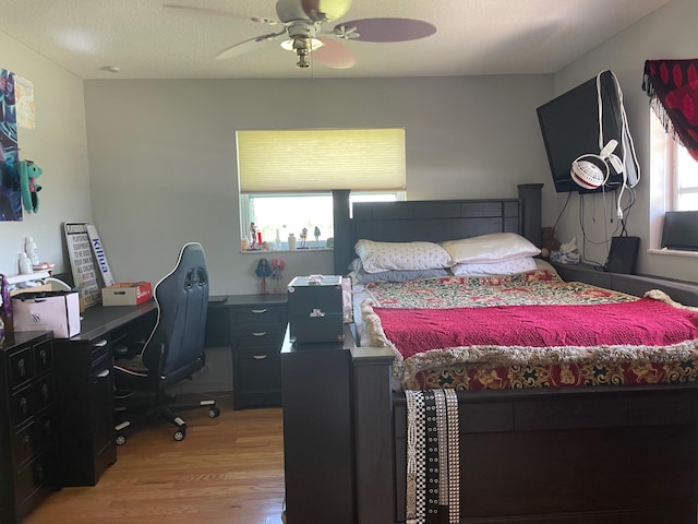 3313 Sherwood Blvd, Delray Beach, FL 33445 - bedroom with light wood-type flooring, a desk, and ceiling fan