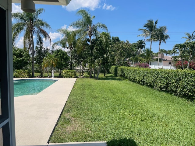 3313 Sherwood Blvd, Delray Beach, FL 33445 - view of grassy yard with an outdoor pool