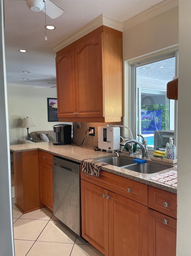 3313 Sherwood Blvd, Delray Beach, FL 33445 - kitchen with dishwasher, a sink, ornamental molding, light tile patterned floors, and backsplash