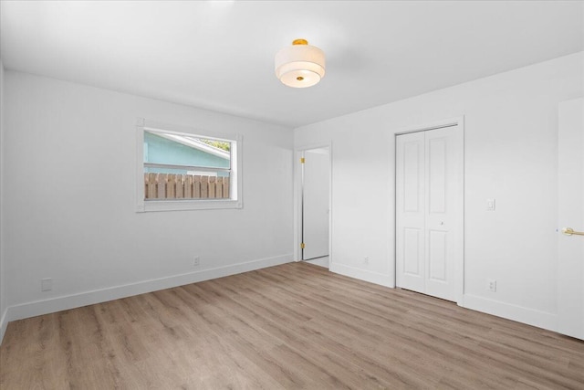 533 Riverside Dr, Palm Beach Gardens, FL 33410 - unfurnished bedroom with wood finished floors and a closet