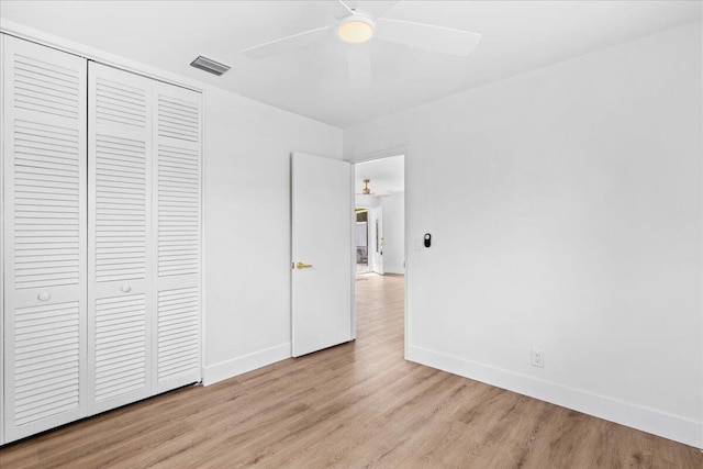 533 Riverside Dr, Palm Beach Gardens, FL 33410 - unfurnished bedroom featuring light wood-style floors, a closet, and a ceiling fan