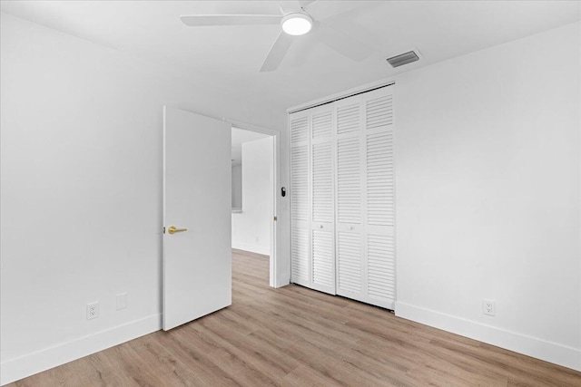 533 Riverside Dr, Palm Beach Gardens, FL 33410 - unfurnished bedroom with wood finished floors, a closet, and a ceiling fan