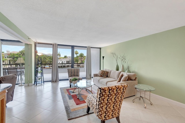 4740 S Ocean Blvd Unit 202, Highland Beach, FL 33487 - living room with light tile patterned floors and baseboards