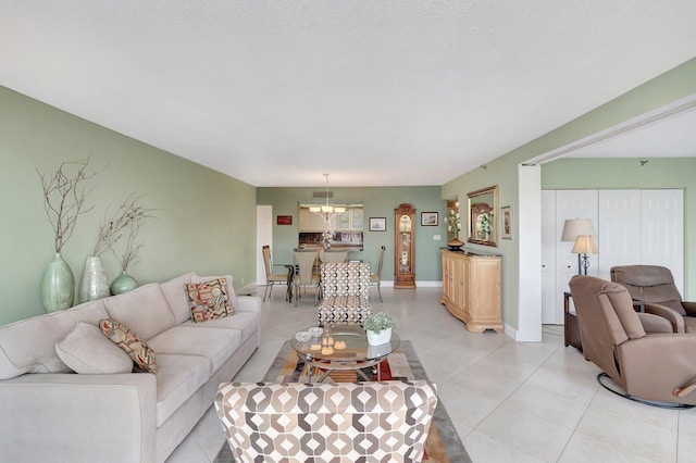 4740 S Ocean Blvd Unit 202, Highland Beach, FL 33487 - living room with light tile patterned floors and a chandelier