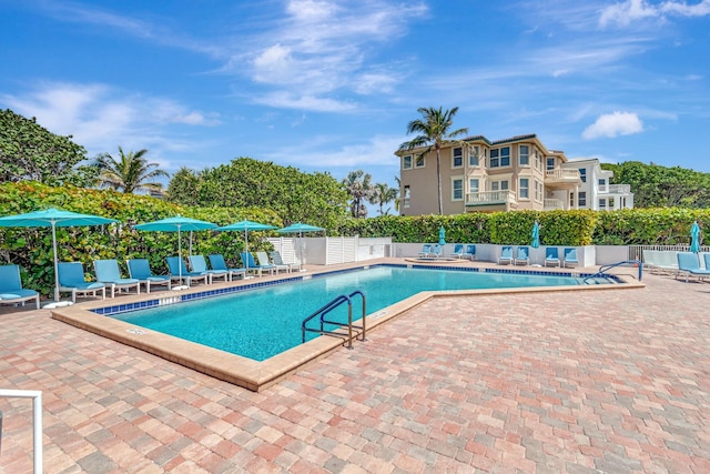 4740 S Ocean Blvd Unit 202, Highland Beach, FL 33487 - community pool with a patio
