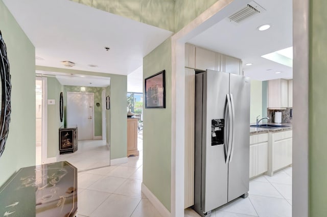 4740 S Ocean Blvd Unit 202, Highland Beach, FL 33487 - hallway with a sink, light tile patterned floors, and recessed lighting