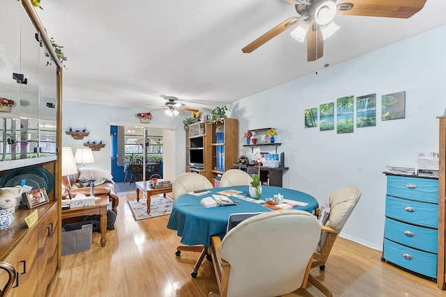 2161 NE 1st Ct Unit 101, Boynton Beach, FL 33435 - dining space featuring a ceiling fan and light wood finished floors