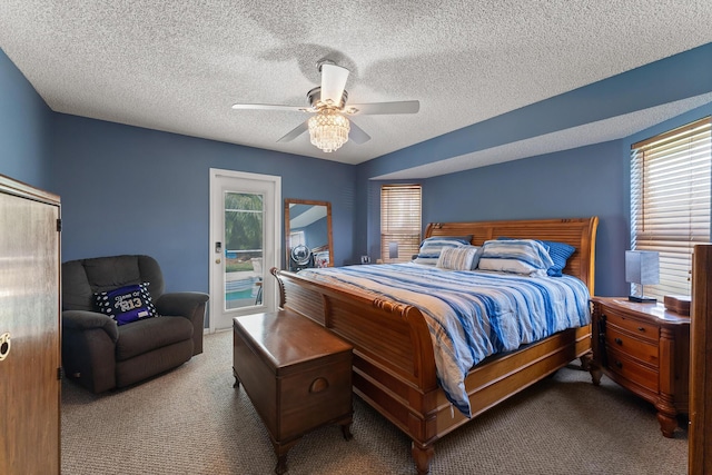504 SW Pea Ct, Port Saint Lucie, FL 34953 - carpeted bedroom with access to exterior, a ceiling fan, and a textured ceiling