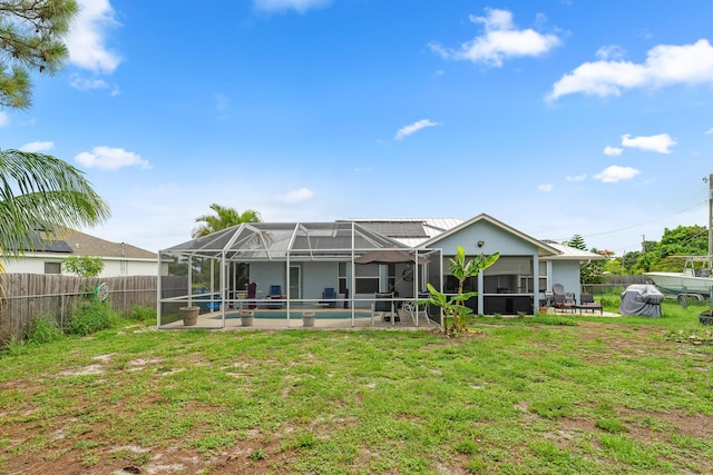 504 SW Pea Ct, Port Saint Lucie, FL 34953 - rear view of house with a patio area and a lanai