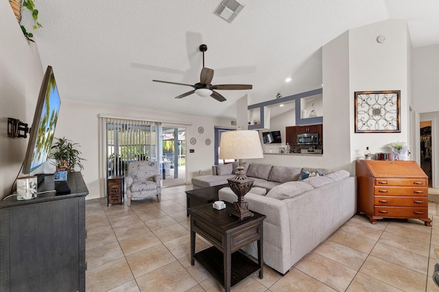 504 SW Pea Ct, Port Saint Lucie, FL 34953 - living room with ceiling fan, light tile patterned flooring, and lofted ceiling