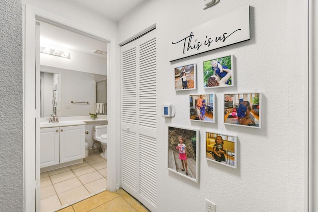 2916 Tuscany Ct Unit 104, Palm Beach Gardens, FL 33410 - bathroom with toilet, a closet, tile patterned floors, and vanity