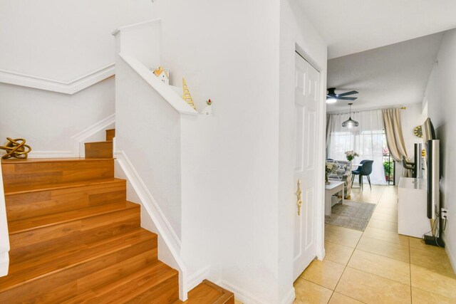 2916 Tuscany Ct Unit 104, Palm Beach Gardens, FL 33410 - staircase with a ceiling fan and tile patterned floors