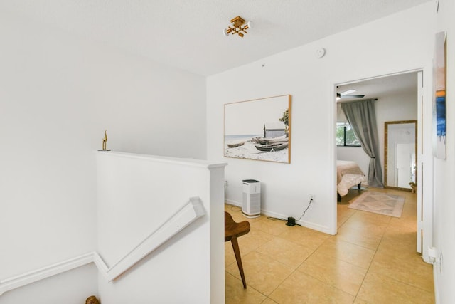 2916 Tuscany Ct Unit 104, Palm Beach Gardens, FL 33410 - hall featuring light tile patterned floors and baseboards