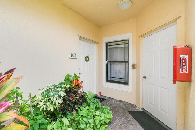 2916 Tuscany Ct Unit 104, Palm Beach Gardens, FL 33410 - property entrance with stucco siding