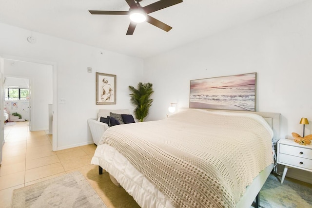 2916 Tuscany Ct Unit 104, Palm Beach Gardens, FL 33410 - bedroom with baseboards, light tile patterned floors, and a ceiling fan