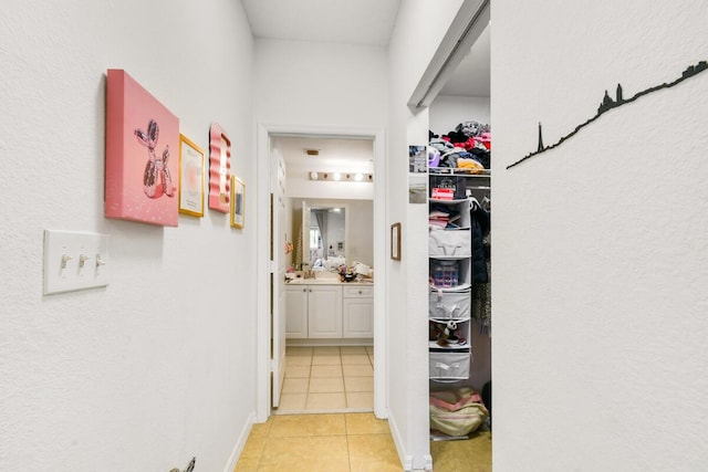 2916 Tuscany Ct Unit 104, Palm Beach Gardens, FL 33410 - hallway with light tile patterned floors and baseboards