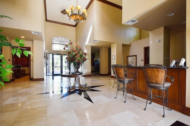 2916 Tuscany Ct Unit 104, Palm Beach Gardens, FL 33410 - lobby with a towering ceiling and ornamental molding