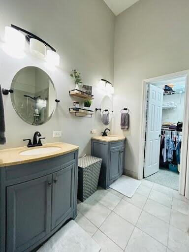 7624 Pinewalk Dr S Unit 147, Margate, FL 33063 - full bath with two vanities and tile patterned floors