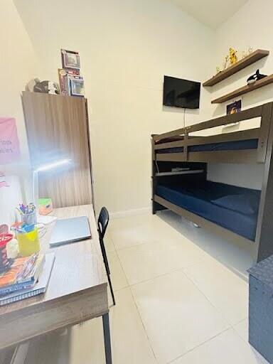 7624 Pinewalk Dr S Unit 147, Margate, FL 33063 - tiled bedroom with baseboards