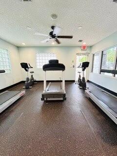 7624 Pinewalk Dr S Unit 147, Margate, FL 33063 - exercise room featuring a textured ceiling and ceiling fan