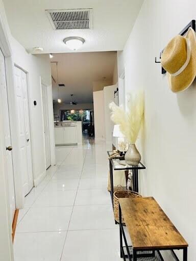 7624 Pinewalk Dr S Unit 147, Margate, FL 33063 - hall featuring light tile patterned flooring