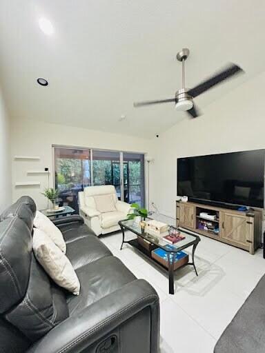 7624 Pinewalk Dr S Unit 147, Margate, FL 33063 - living area featuring ceiling fan and lofted ceiling