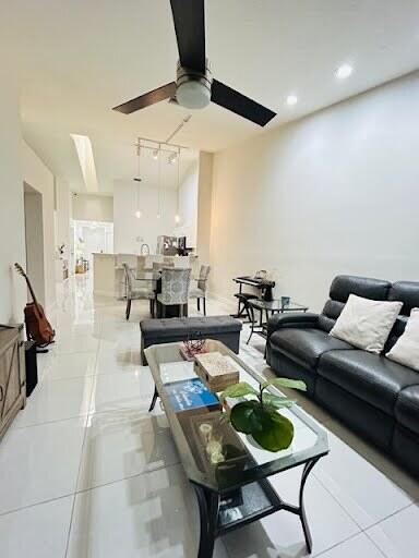 7624 Pinewalk Dr S Unit 147, Margate, FL 33063 - tiled living room with a ceiling fan and recessed lighting